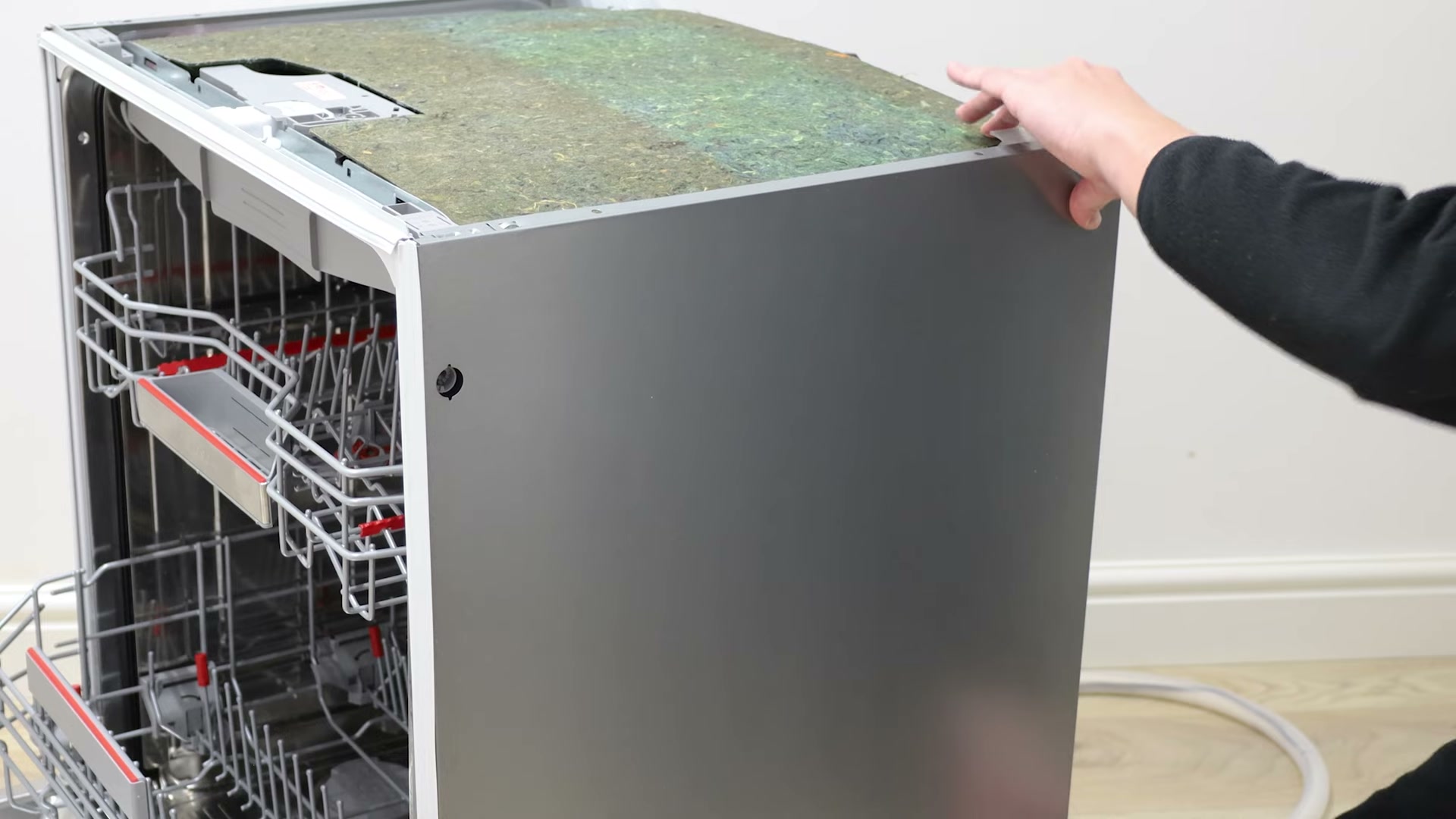 Reattaching the side panel to a Bosch dishwasher after replacing the actuator
