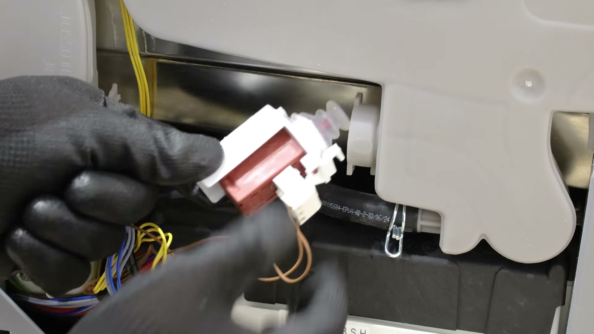 Removing the old actuator from a Bosch dishwasher