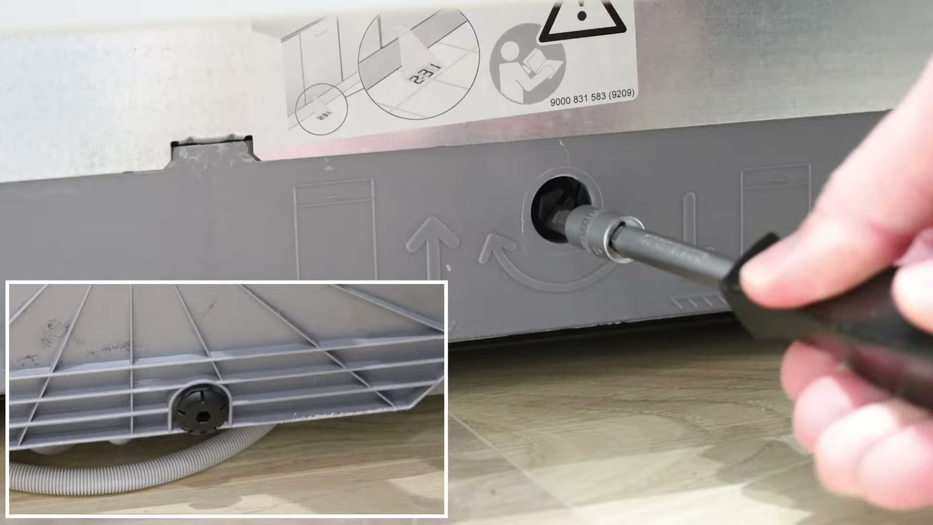 Adjusting the rear central foot on a Bosch dishwasher with a flathead screwdriver