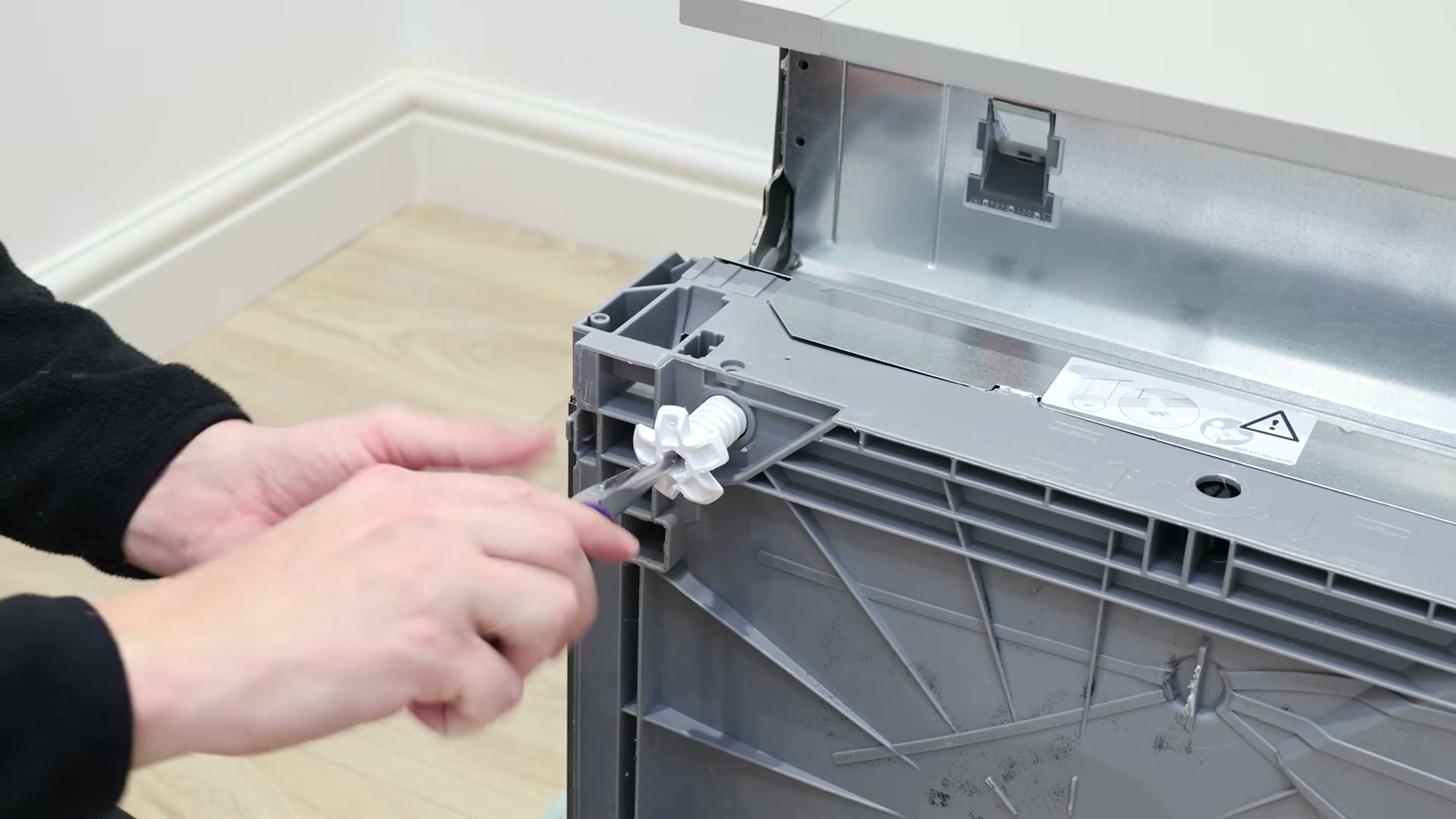 Fitting a new adjustable foot into the base of a Bosch dishwasher