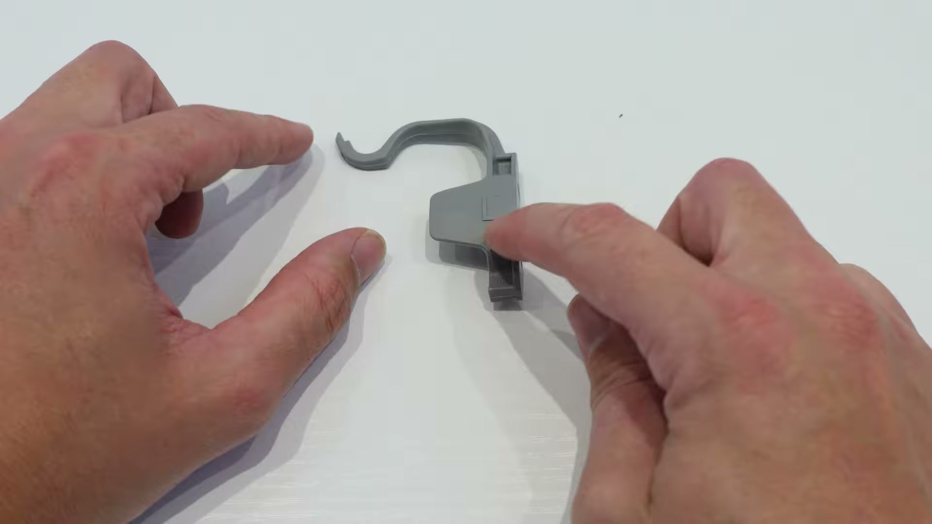 New Bosch dishwasher basket rail clip with the L marking visible