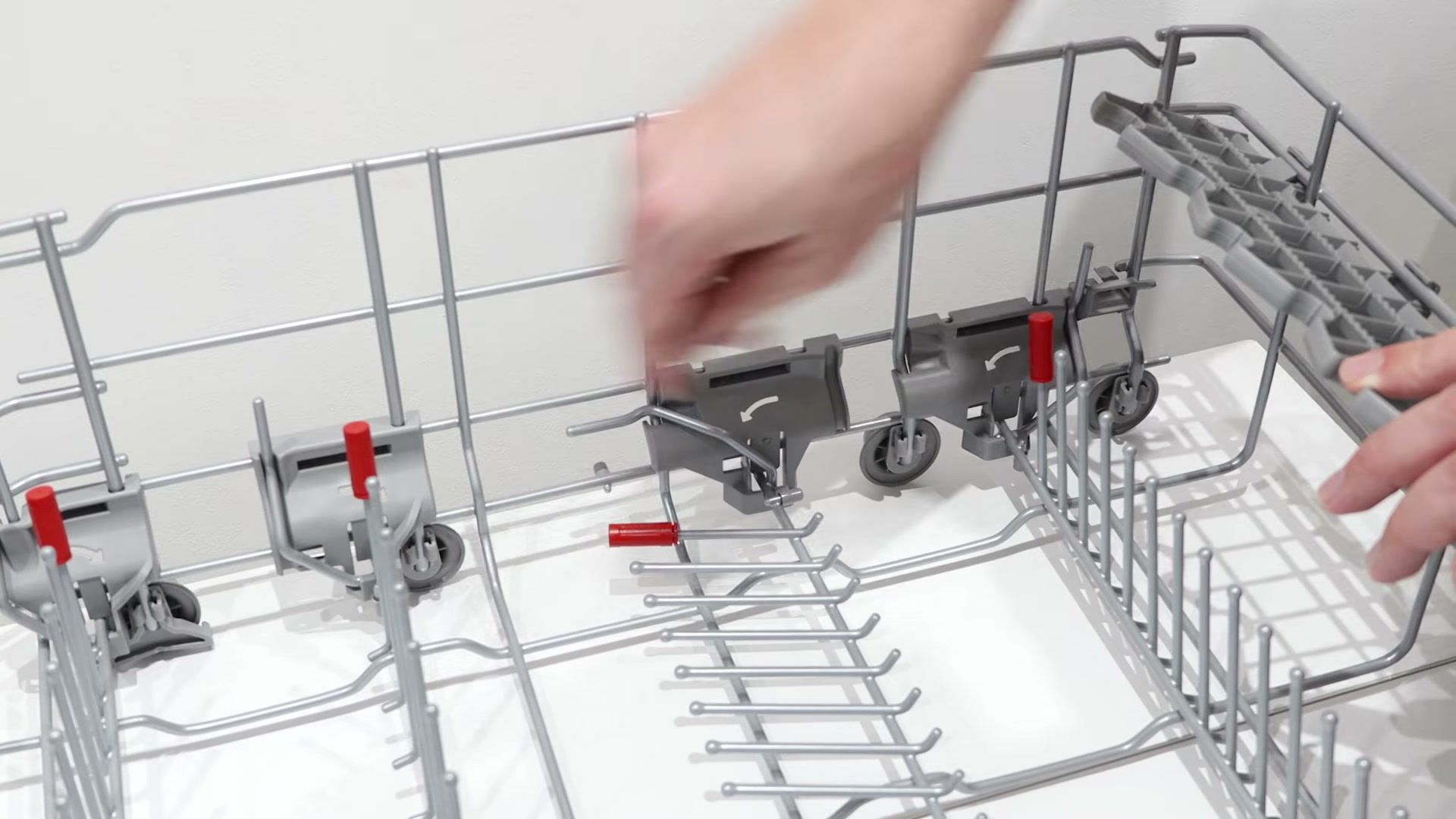 Testing the plate holders on the Bosch dishwasher basket fold up and down freely