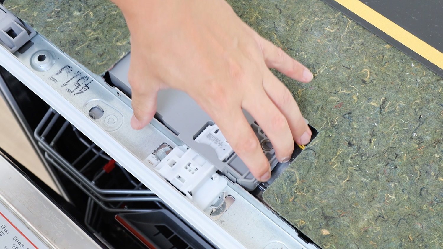 slide in place and under metal tabs