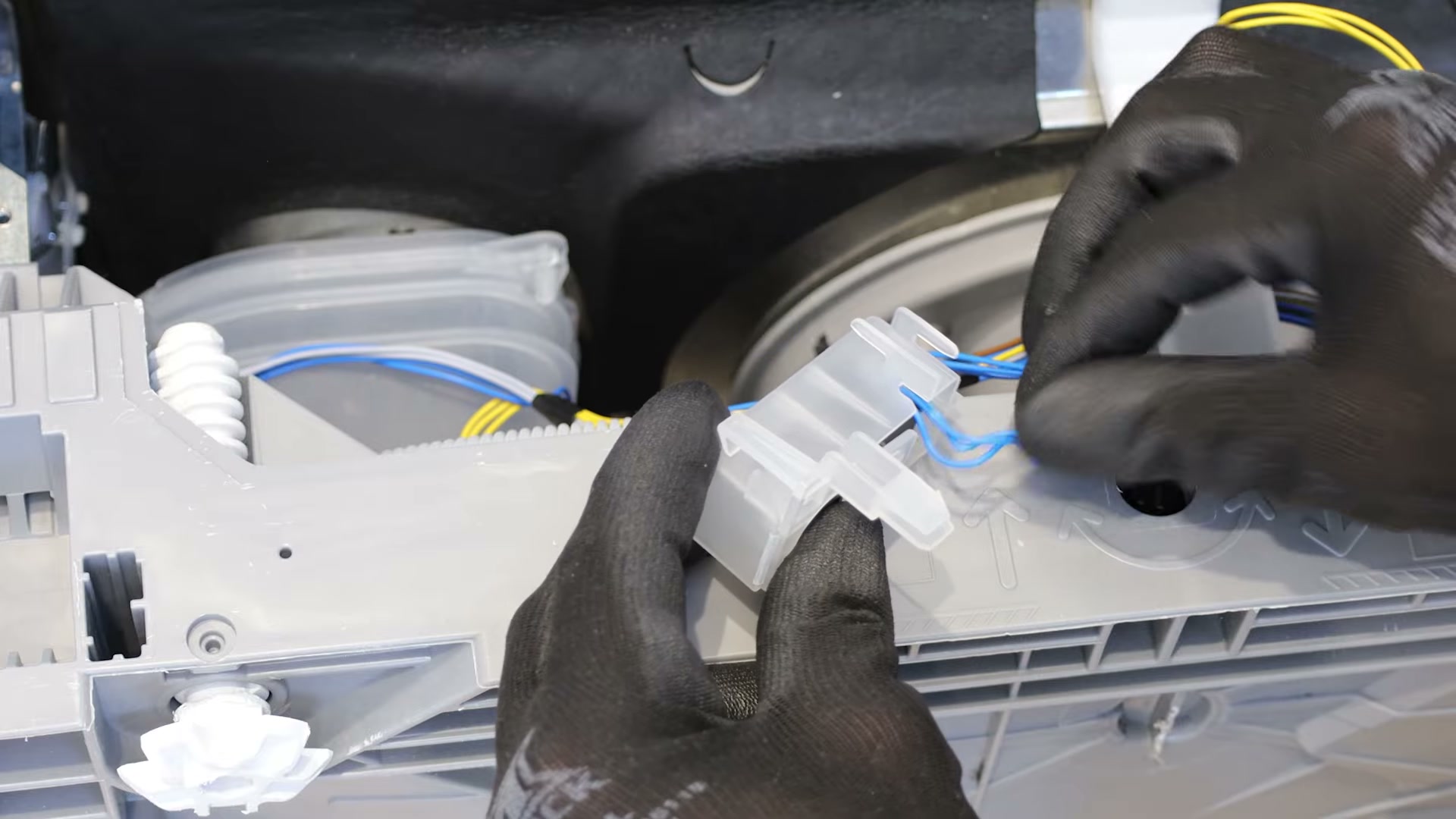 Old Bosch dishwasher float switch housing being opened to disconnect the electrical wiring