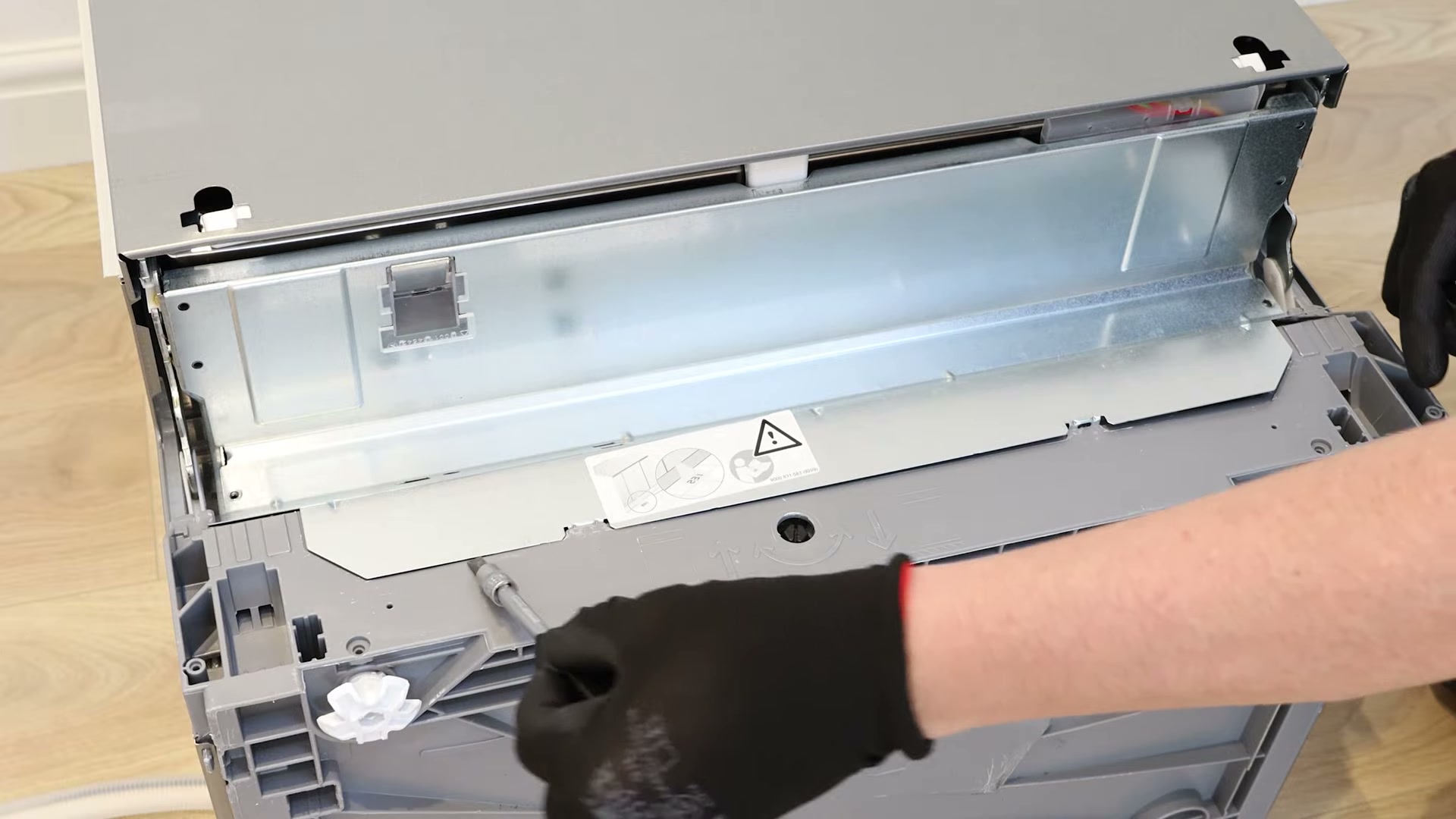 Removing the kick plate and insulation from the base of a Bosch dishwasher
