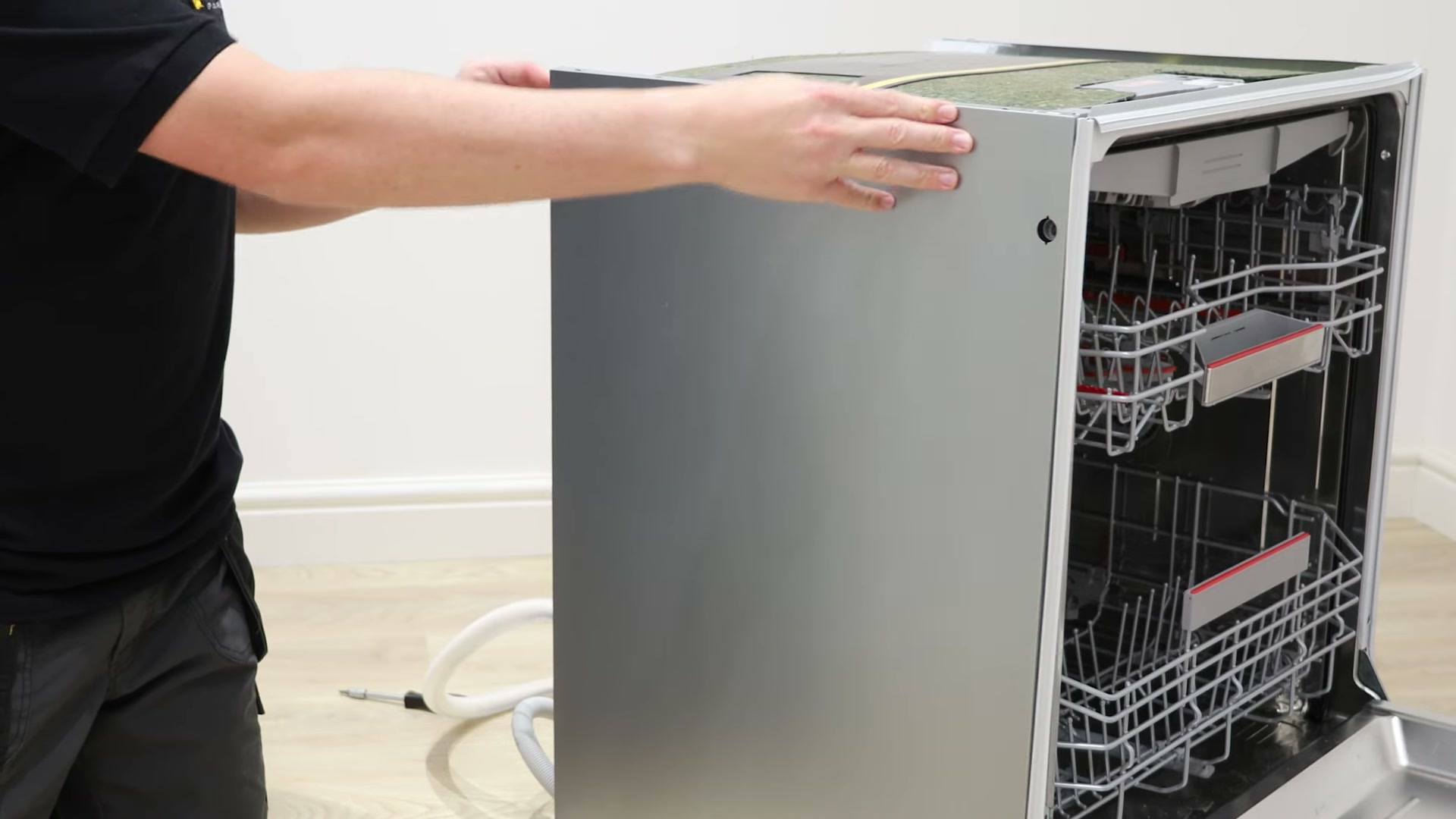 Reattaching the side panel to a Bosch dishwasher after replacing the regeneration valve