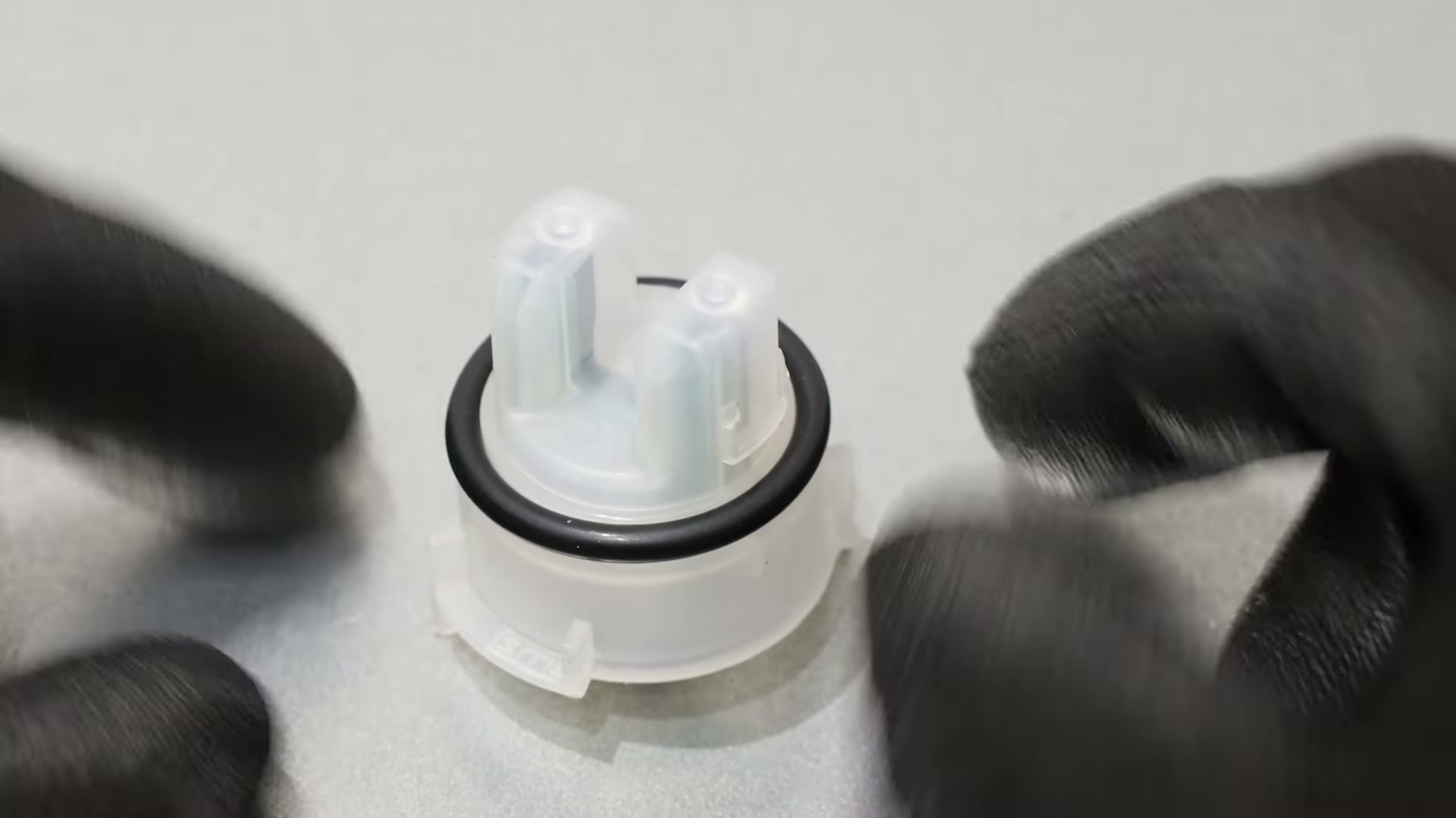 Close-up of the new Bosch water turbidity sensor showing the rubber O-ring and alignment tabs