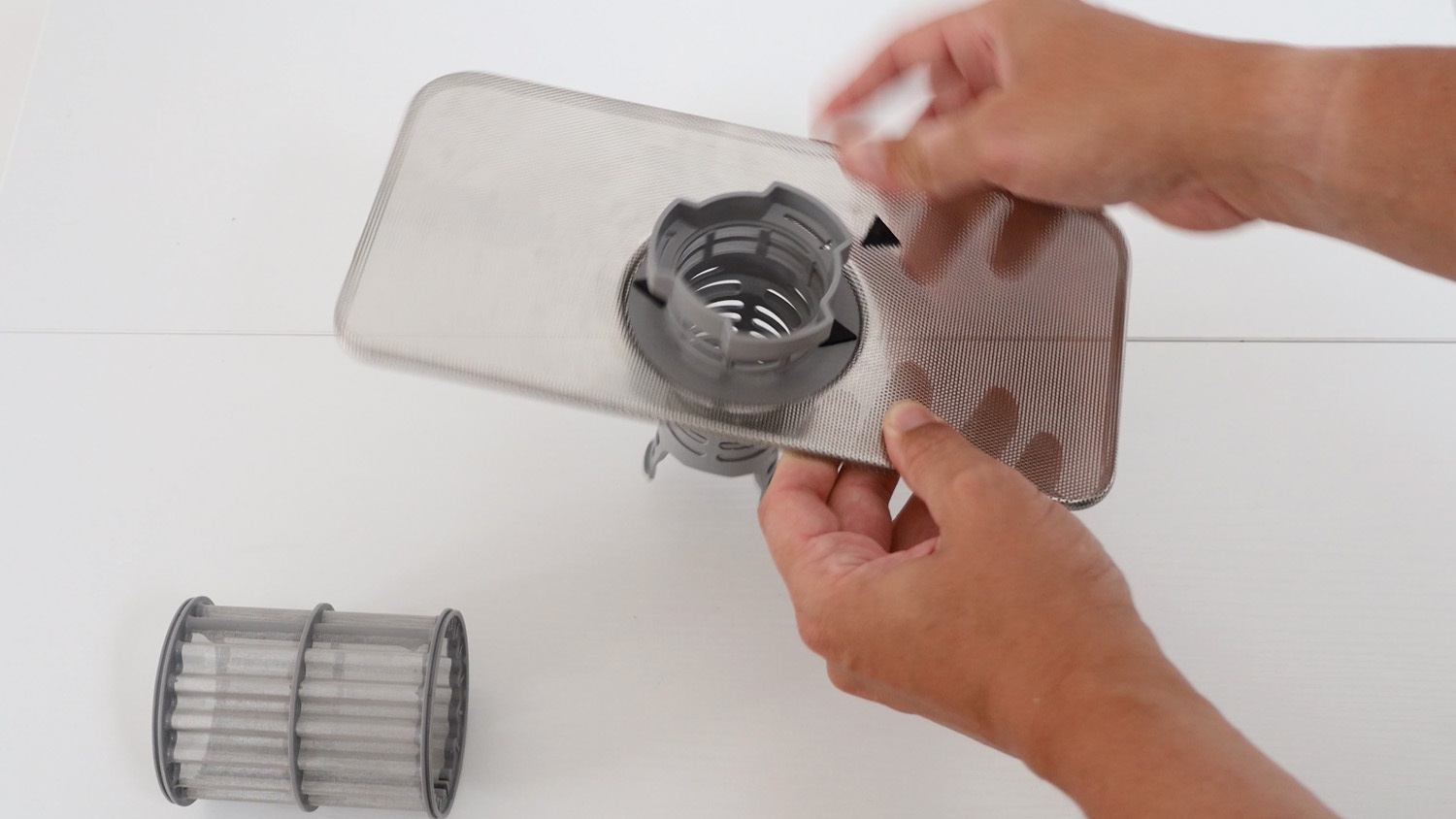 attach plastic part of filter to new filter plate