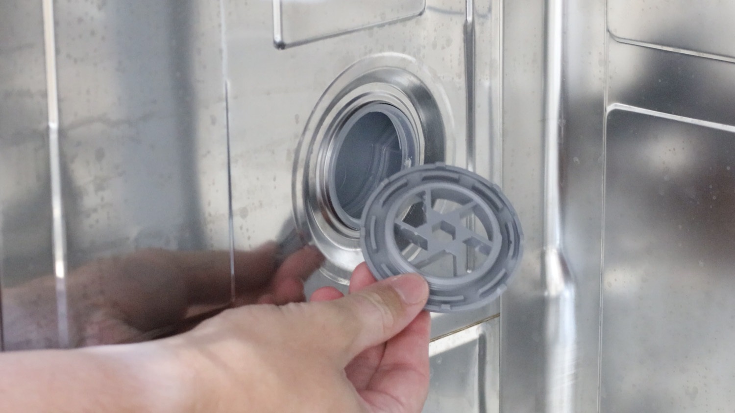 unscrew by hand