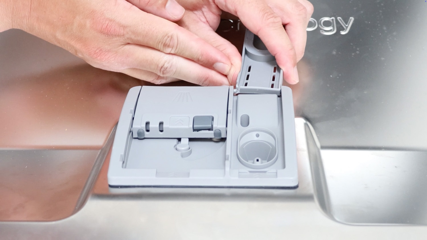 Attach new detergent lid cover and seal