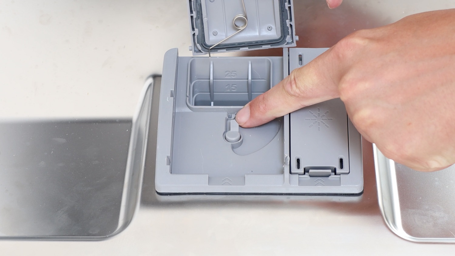 where to insert new dispenser lid flap and spring