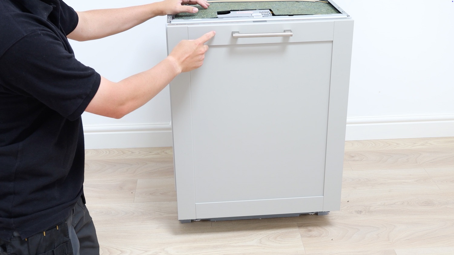 Remove integrated dishwasher cabinet door