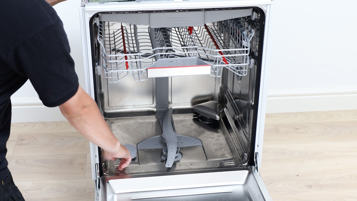 showing where to find salt cap on dishwasher