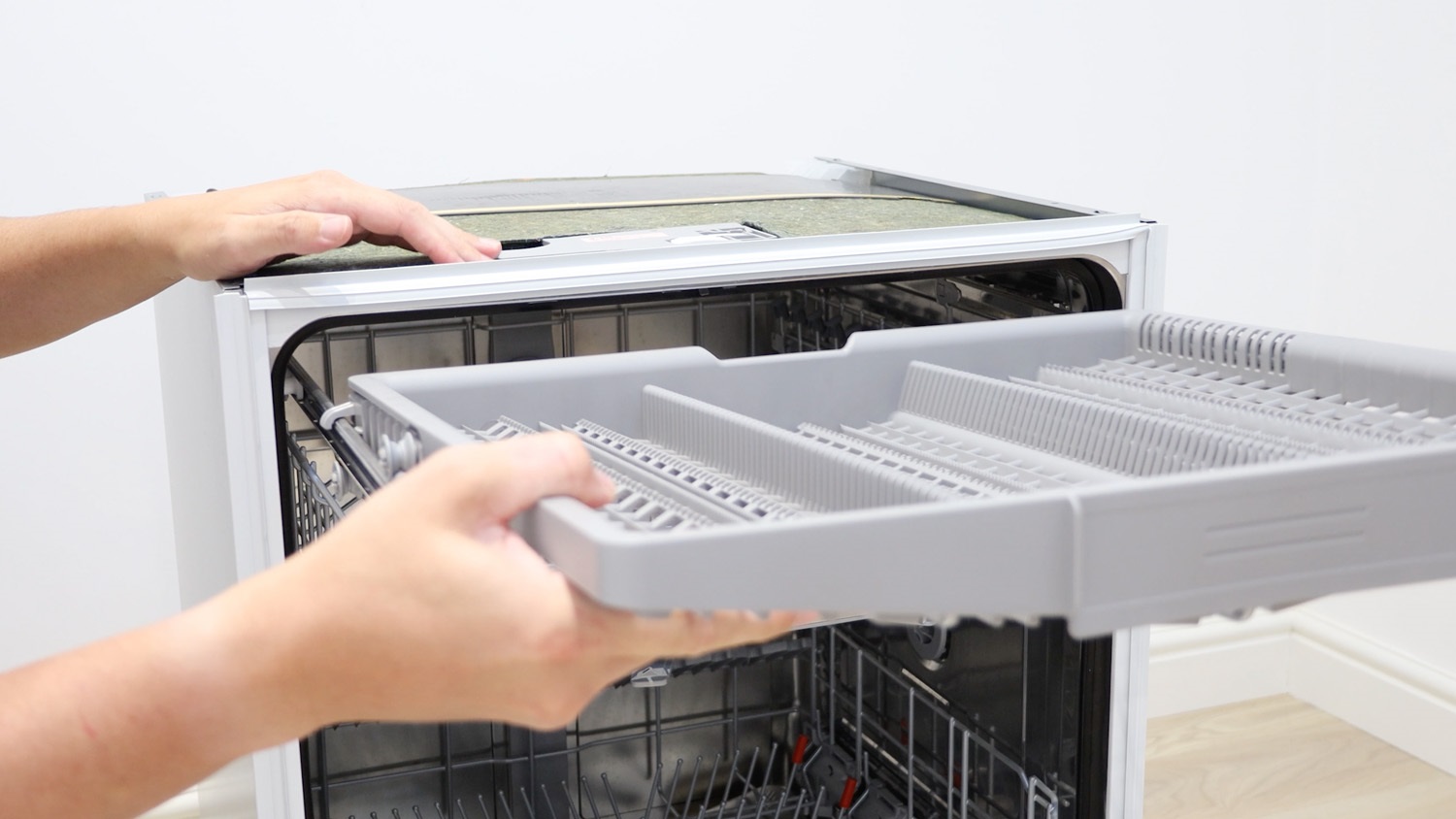 remove top cutlery rack if applicable