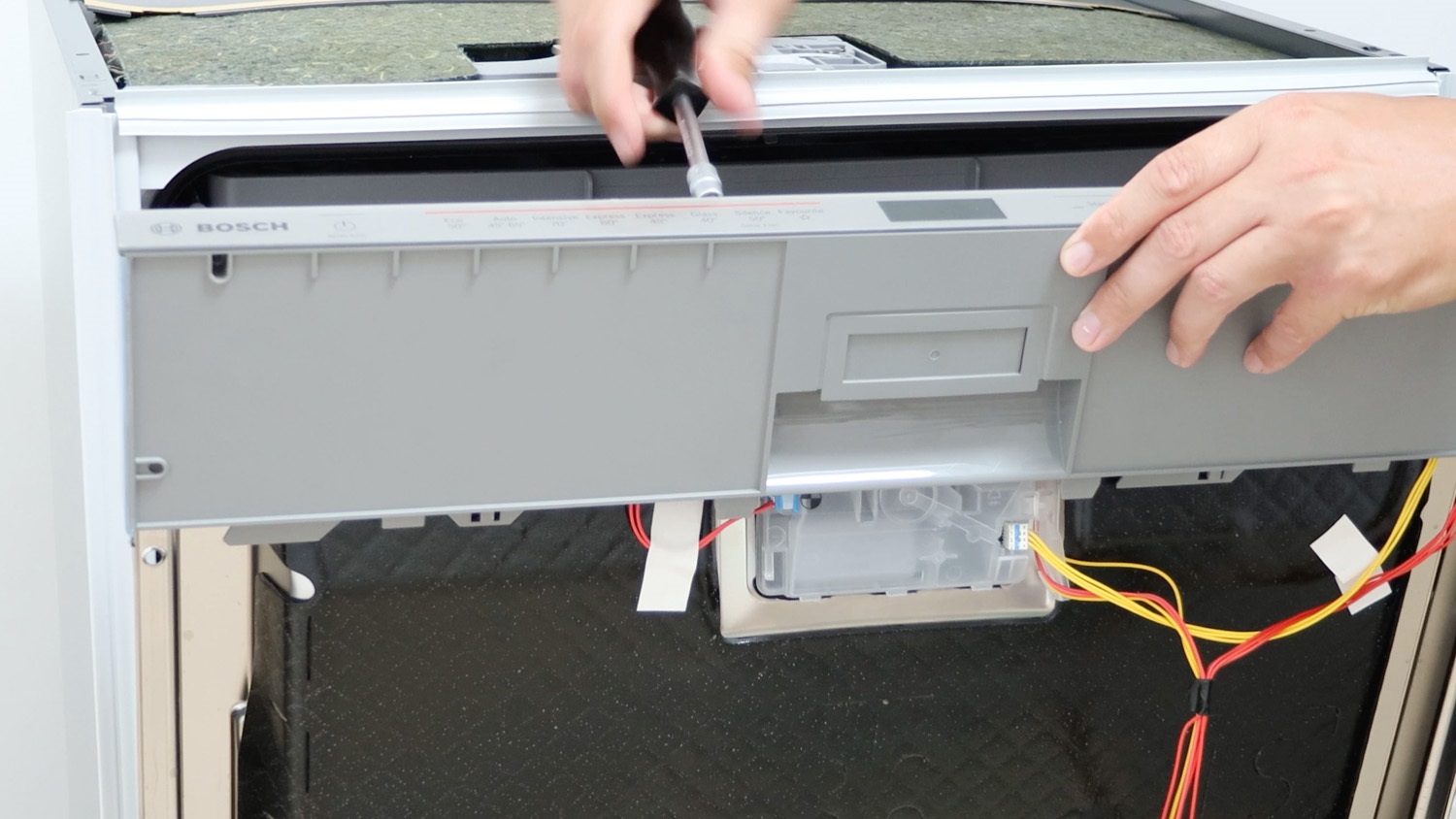 Place control panel and re-screw screws in