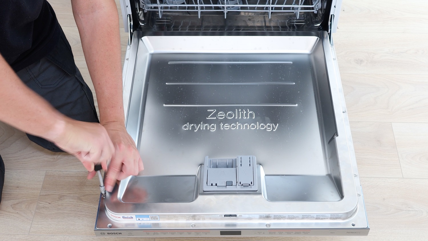 Remove screws holding control panel in place