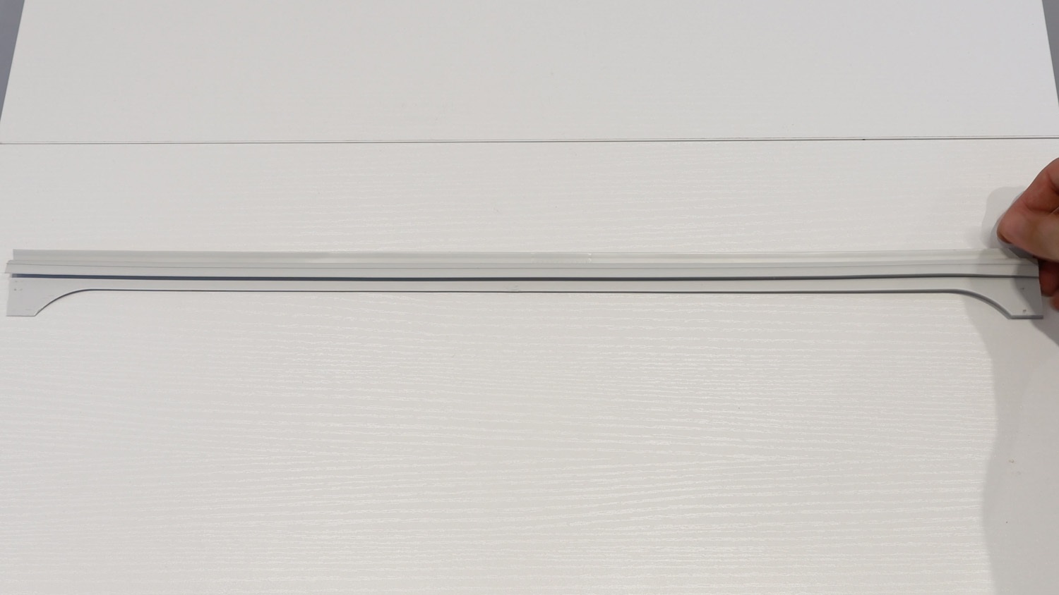 unpackage new upper door seal strip