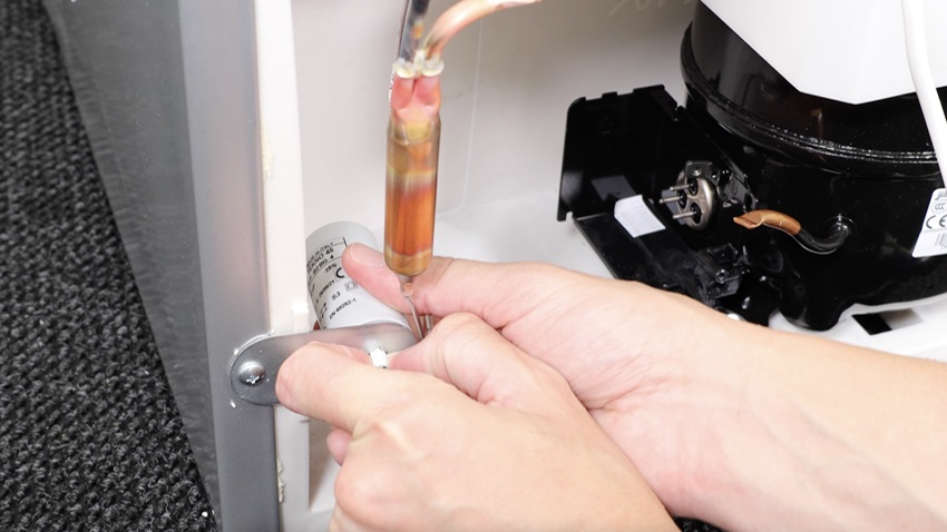 Access and remove old capacitor