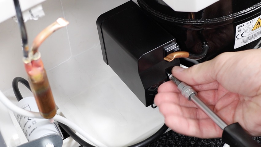 Access and remove old capacitor
