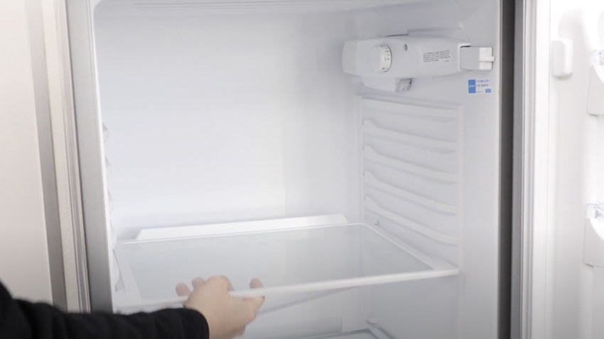 Remove items and shelves from fridge freezer