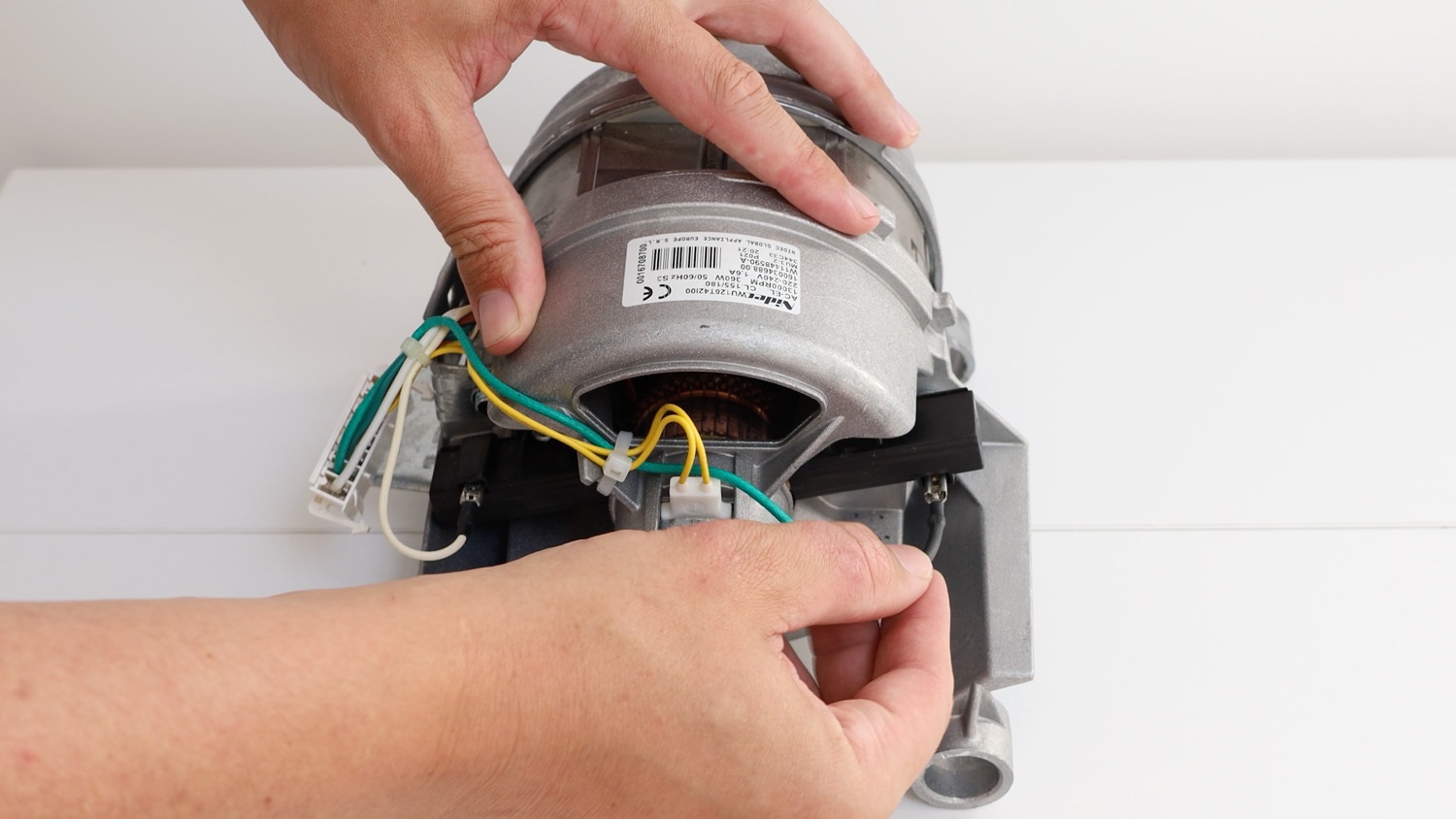 Attach electrical connectors to new carbon brushes