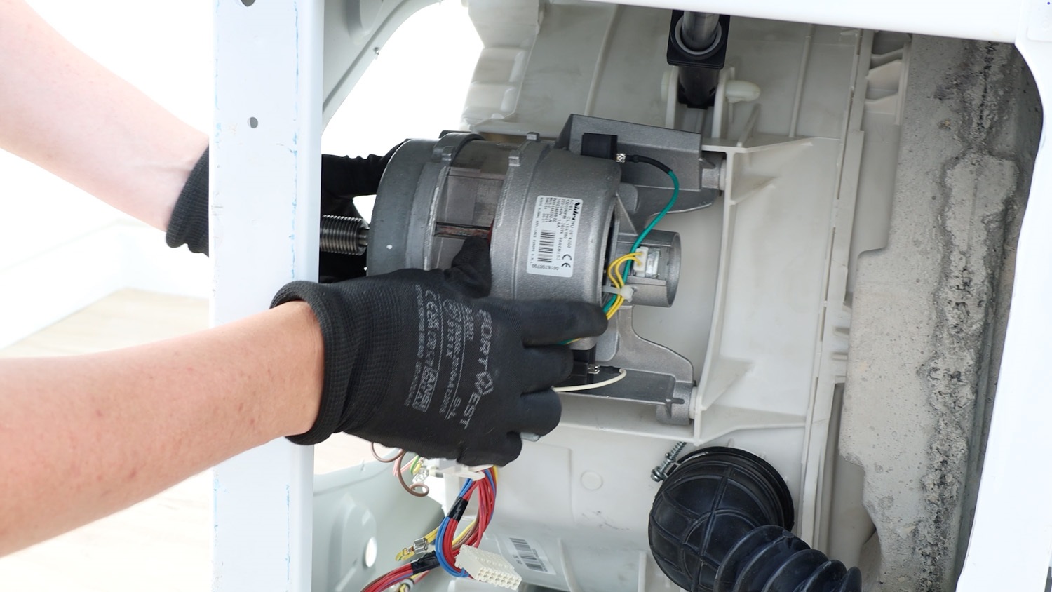 Re-insert motor unit back into washing machine