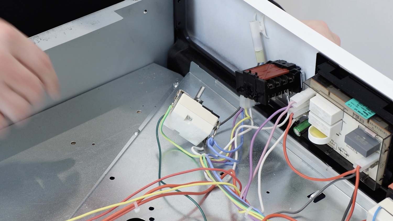 Attach new temperature switch to oven control panel
