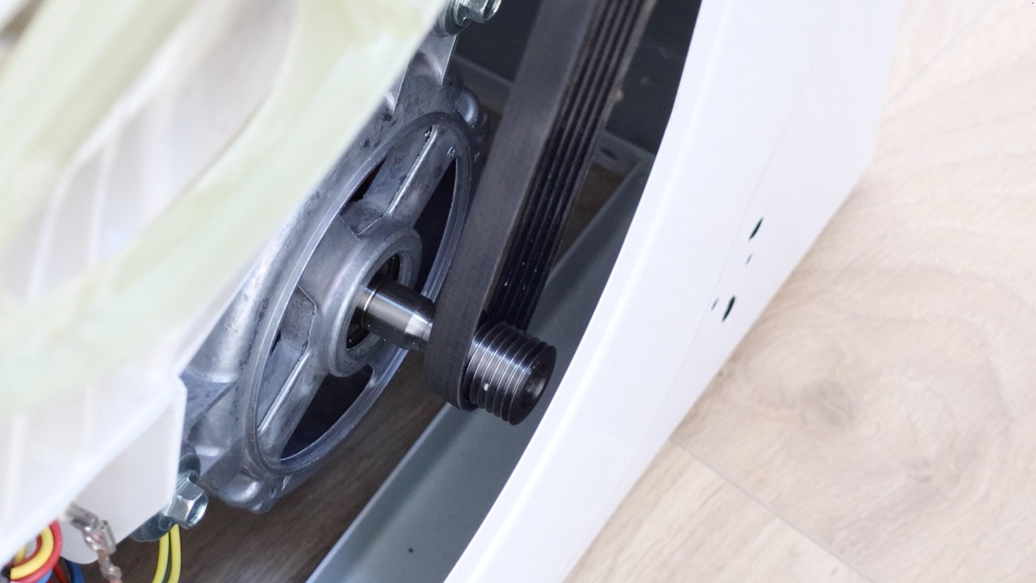 Attach new belt to motor spindle