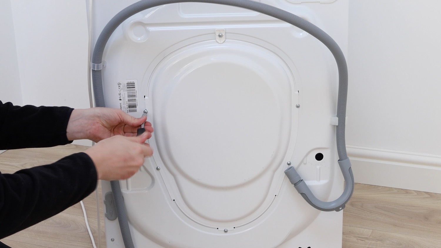 Remove screws from rear of washing machine