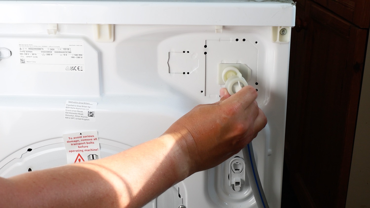 Remove hose from washing machine