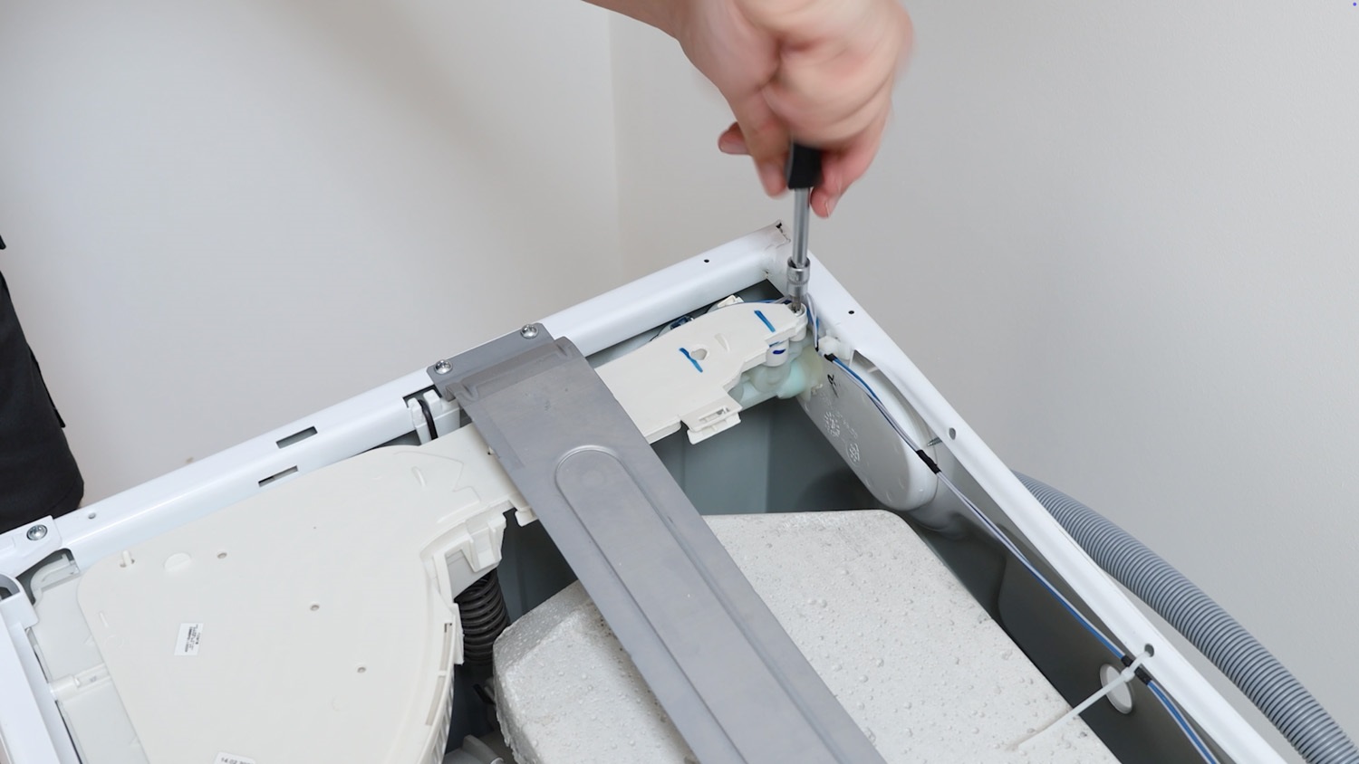 Re-screw two screws holding the water inlet fill valve in place