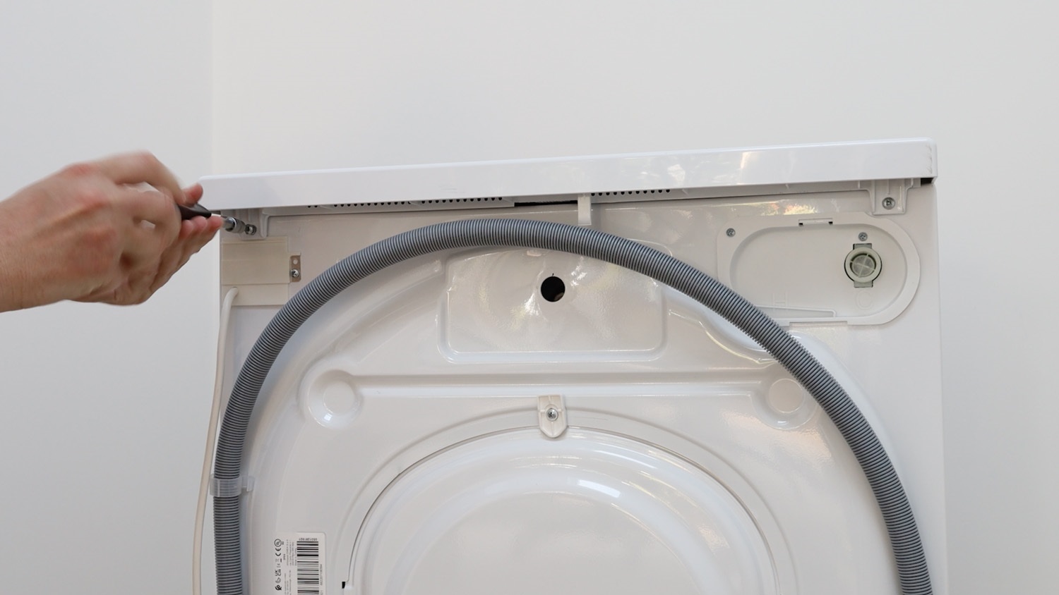 Remove two screws holding lid in place