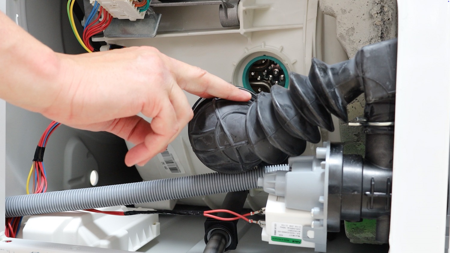 Remove part of sump hose from drum