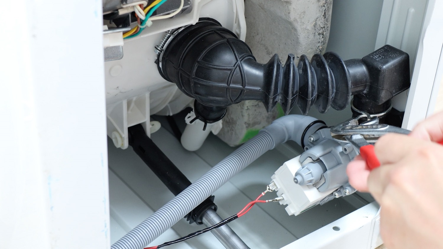 Squeeze wire hose clamp together and move down in place