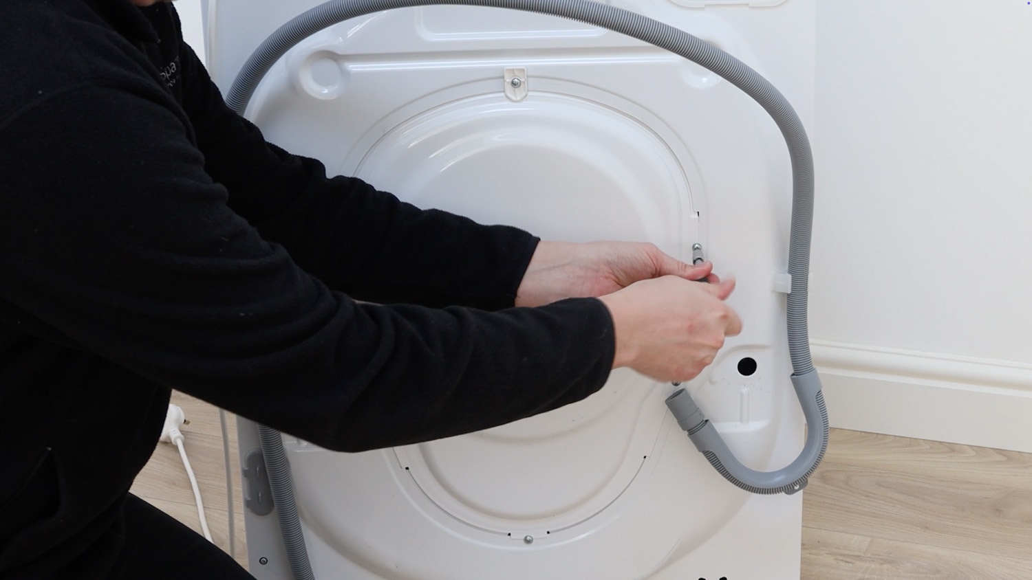 Remove screws on rear of washing machine