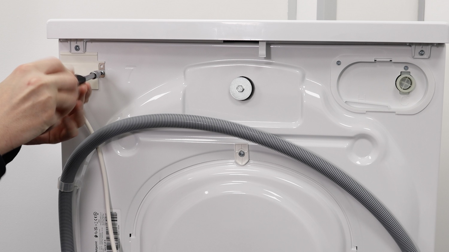 Remove screw holding 1.75m to back of washing machine