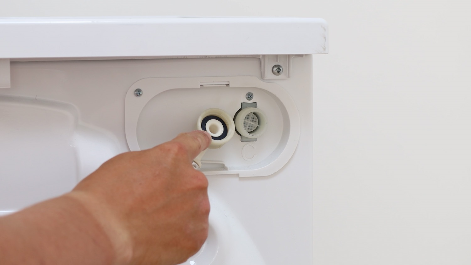 Attach curved end of fill hose to washing machine