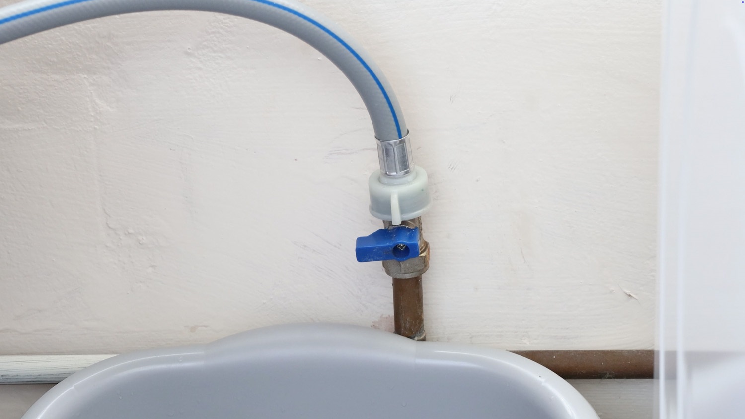 Place tub under the pipe and valve