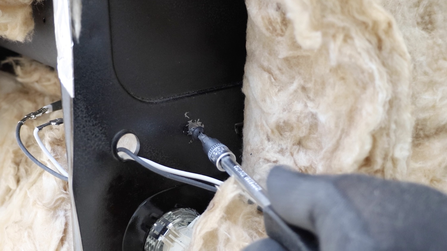 Re-screw screw holding element tray in place