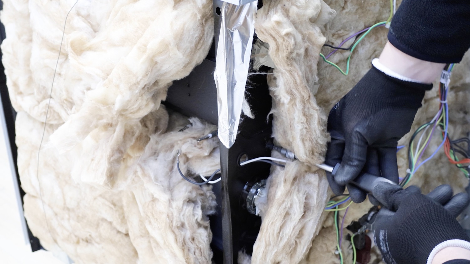 Remove screw holding the bottom element tray in place