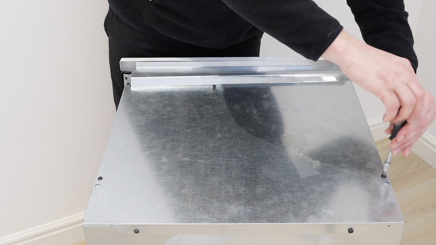 Unscrew screws of top panel