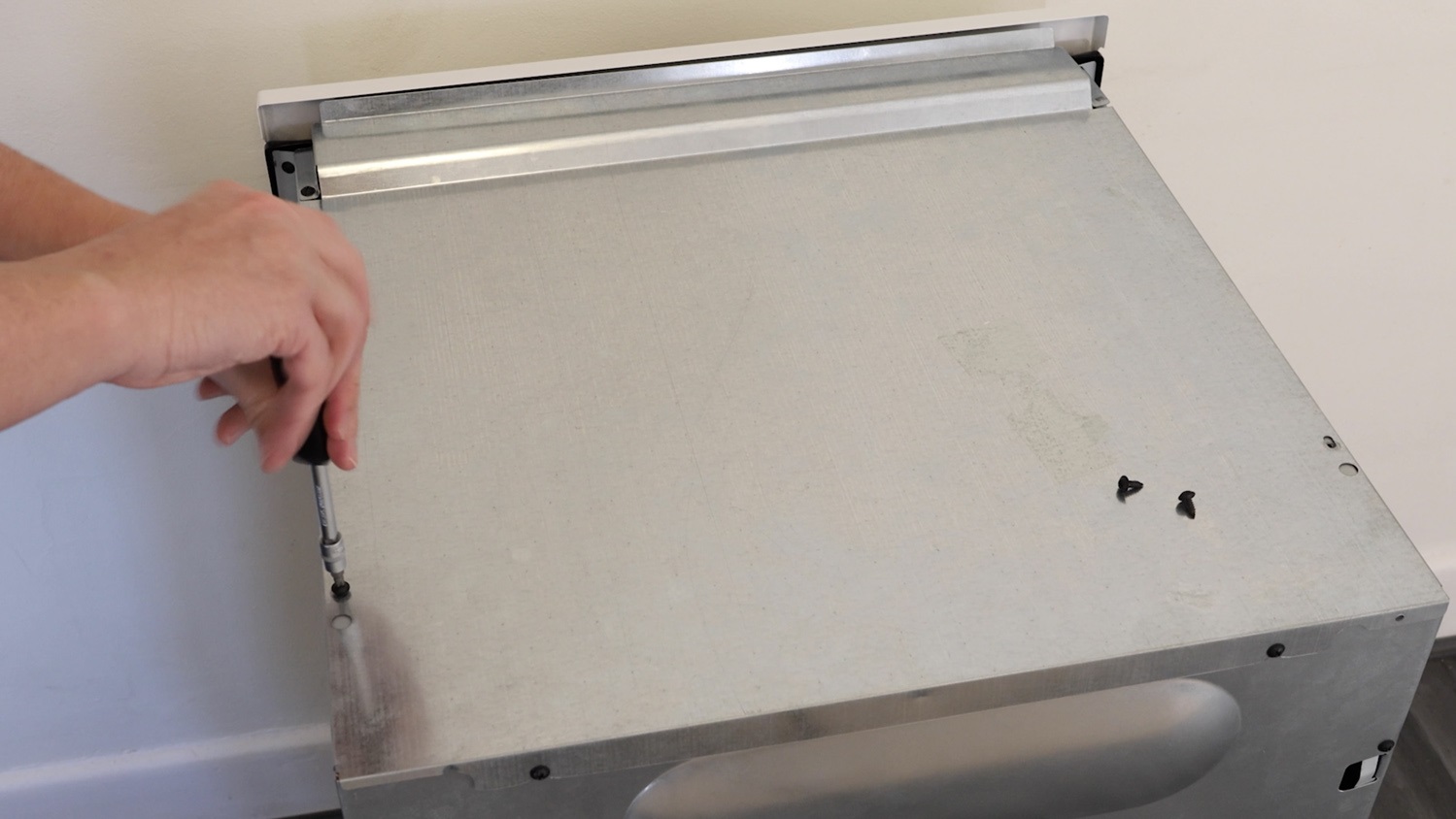 Remove the top screws