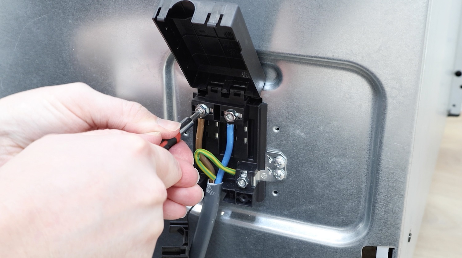 Attach electrical wiring to new terminal block
