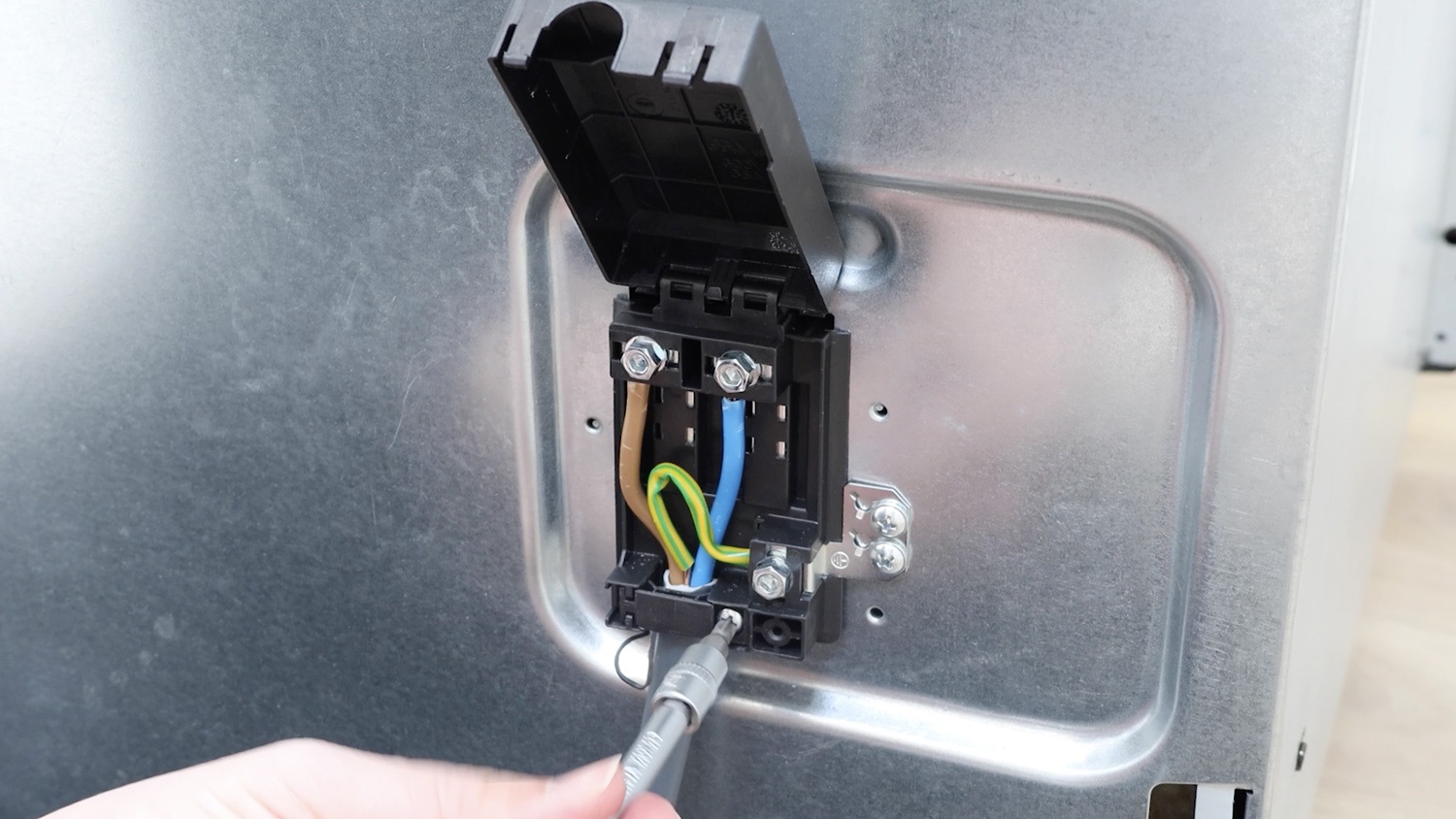 Attach electrical wiring to new terminal block
