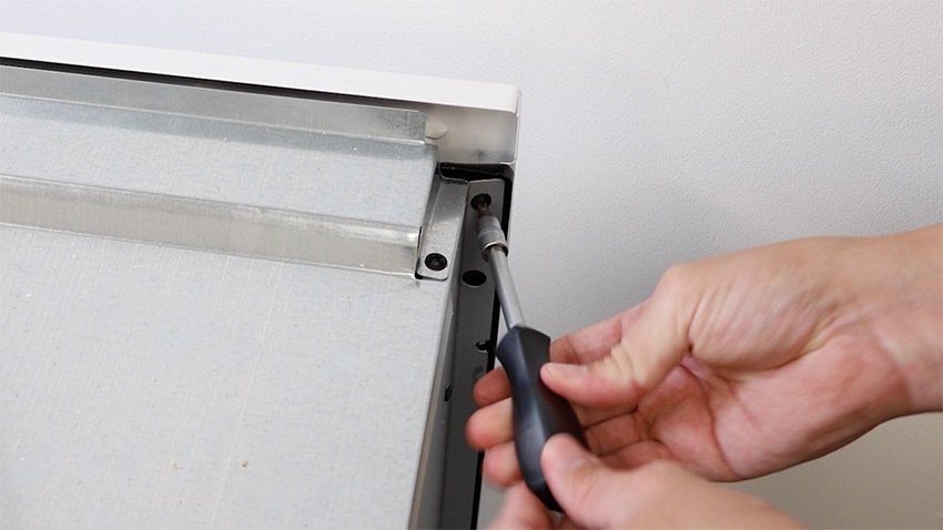 Re-screw screws on both sides of oven front panel