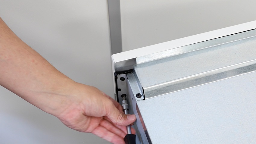 Remove screws on either side holding the oven front panel in place
