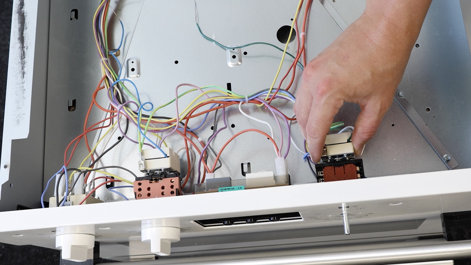 Attach new thermostat to front panel