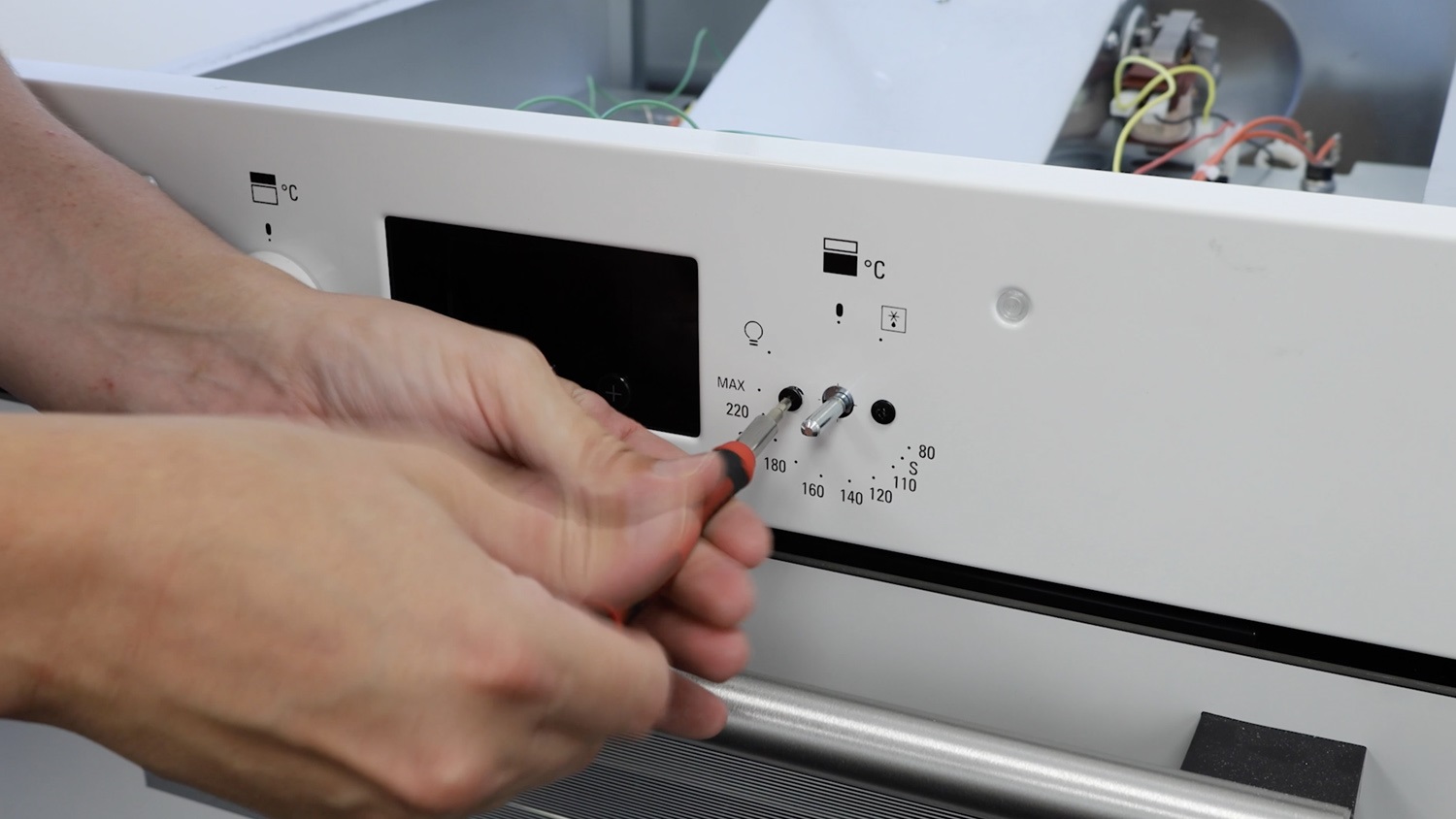 Remove both screws