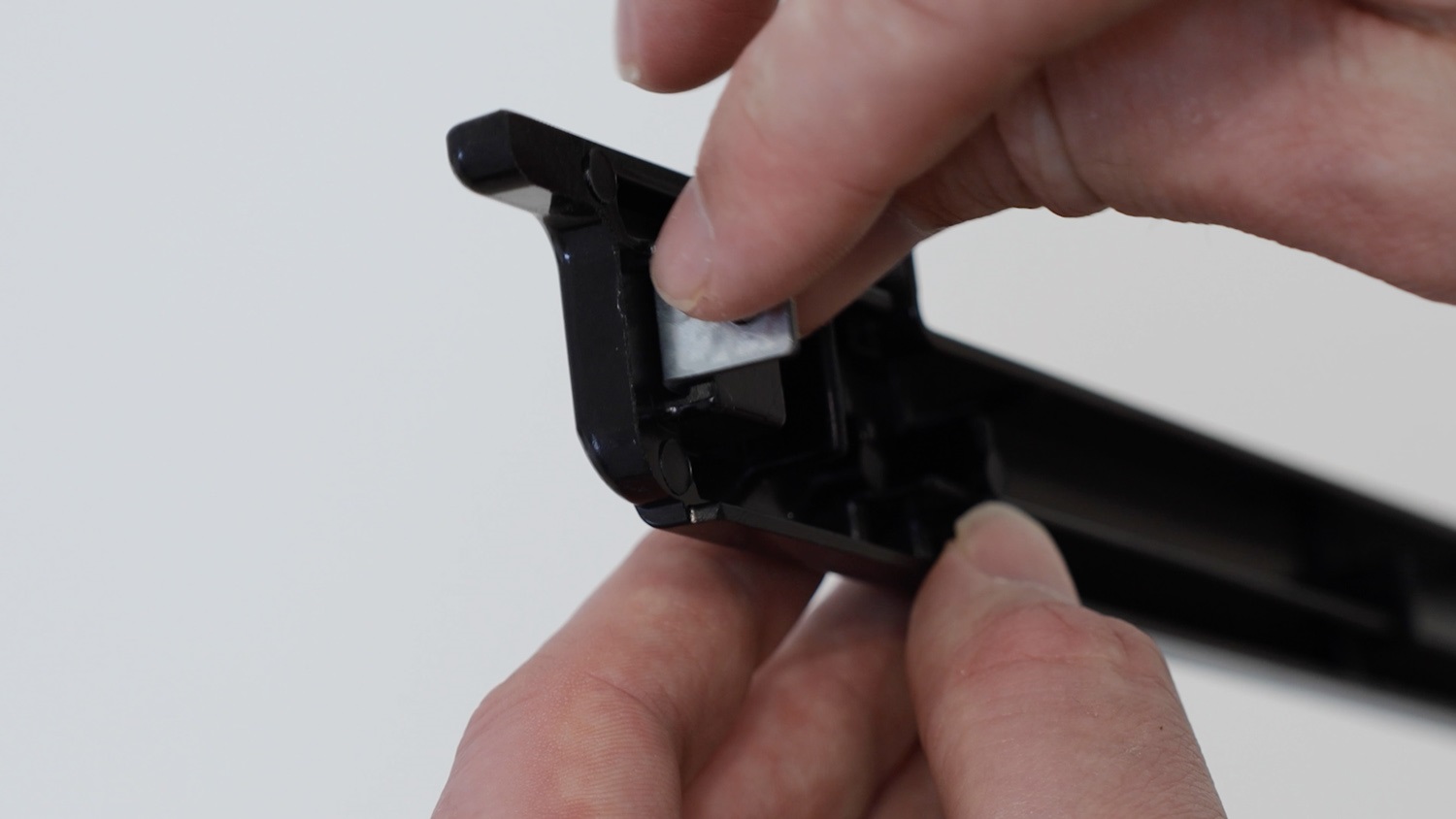 Insert the fixing brackets to the trim