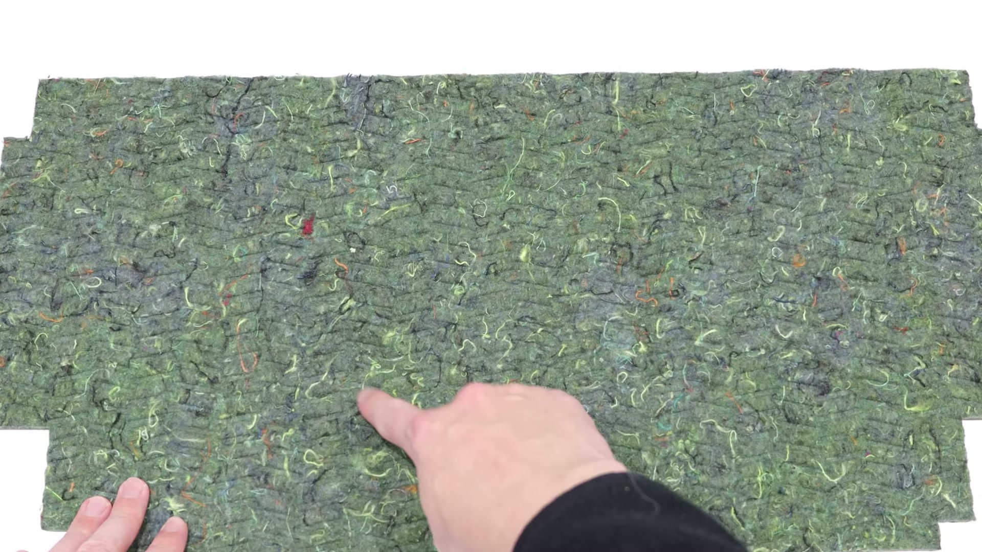 Showing the curved pattern side of a new Bosch dishwasher insulation plate